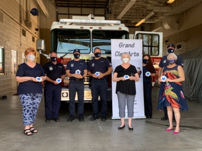 Battalion Chief Wade Rogers accepted “Thirsty Heart Coasters”